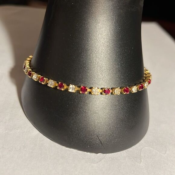 Ladies 8” faux Ruby/Diamond tennis bracelet. - Picture 2 of 5
